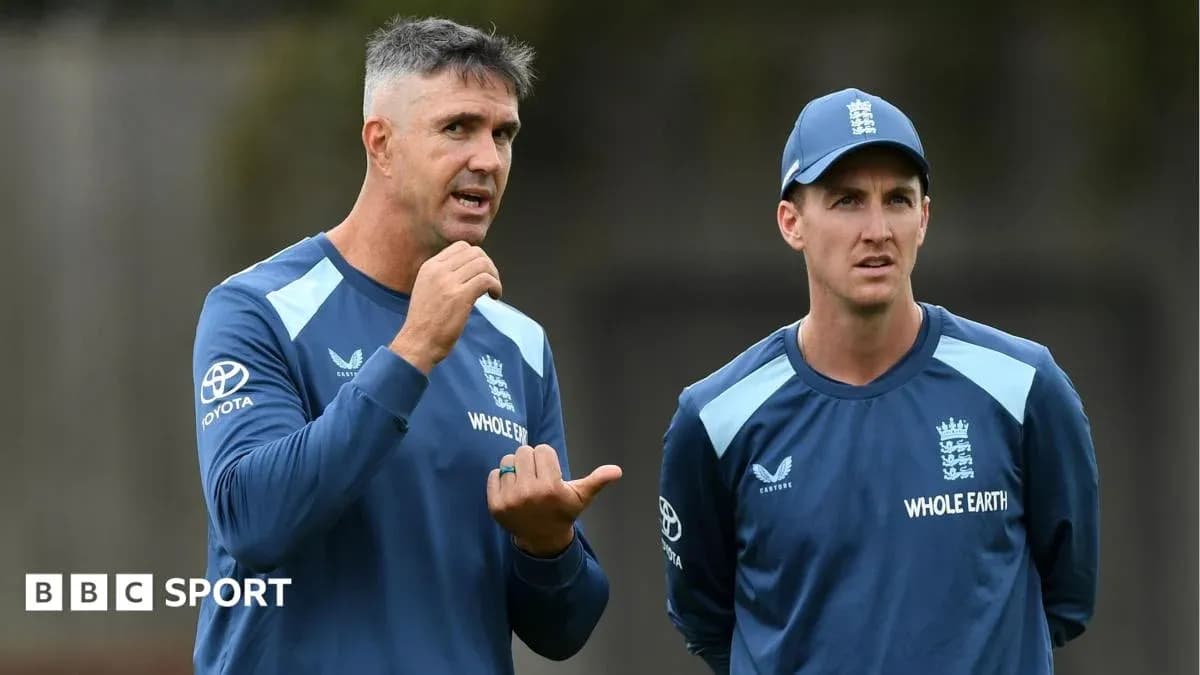 Cricket coach discussing strategy with player Cricket coach discussing strategy with player