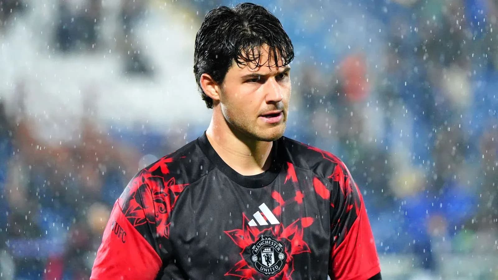 Goalkeeper in Manchester United kit during rain Goalkeeper in Manchester United kit during rain