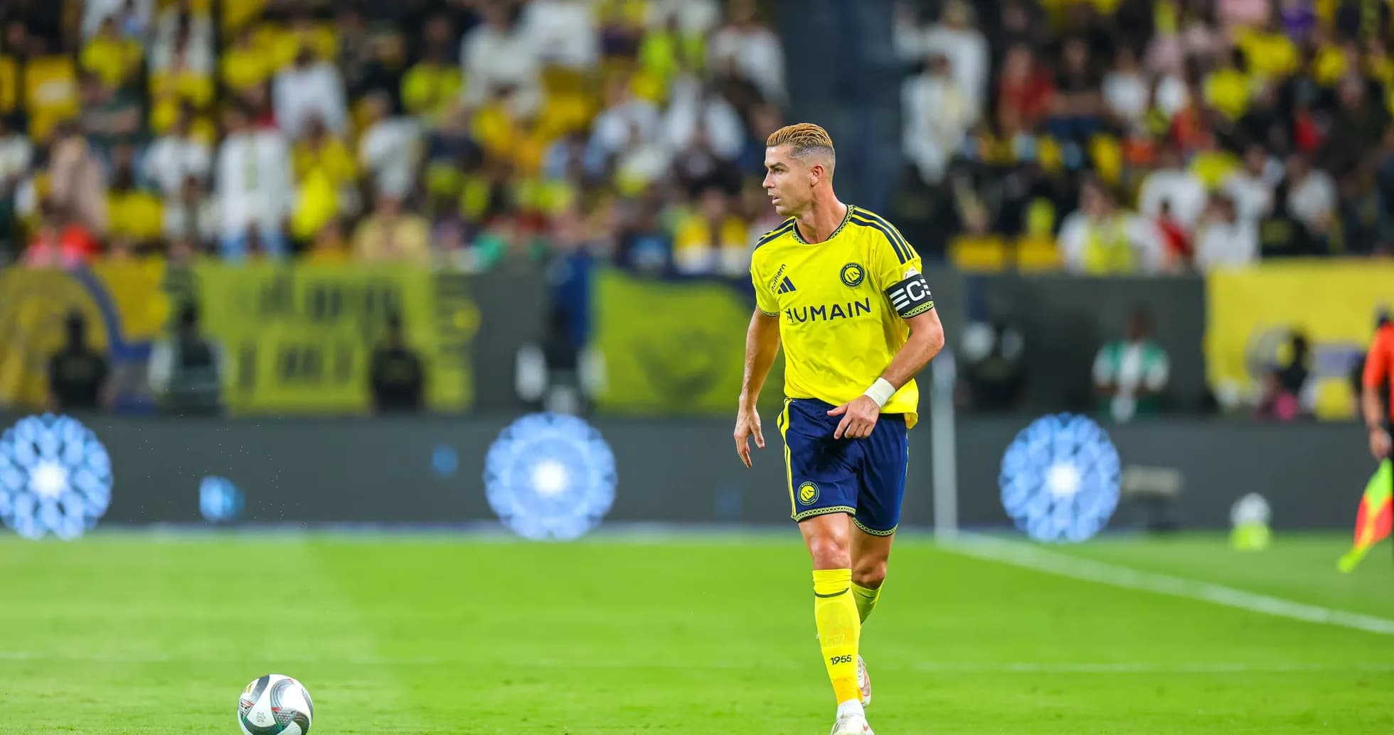 Player in yellow jersey on the field during match Player in yellow jersey on the field during match