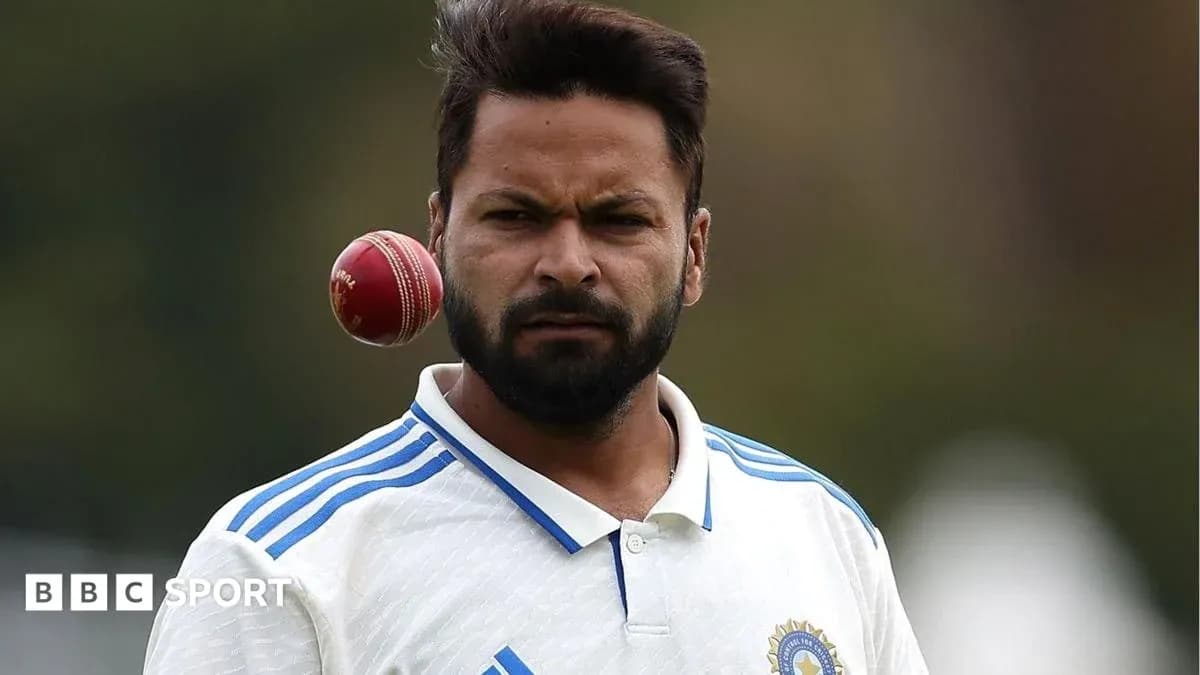 Cricketer preparing to bowl with a cricket ball Cricketer preparing to bowl with a cricket ball
