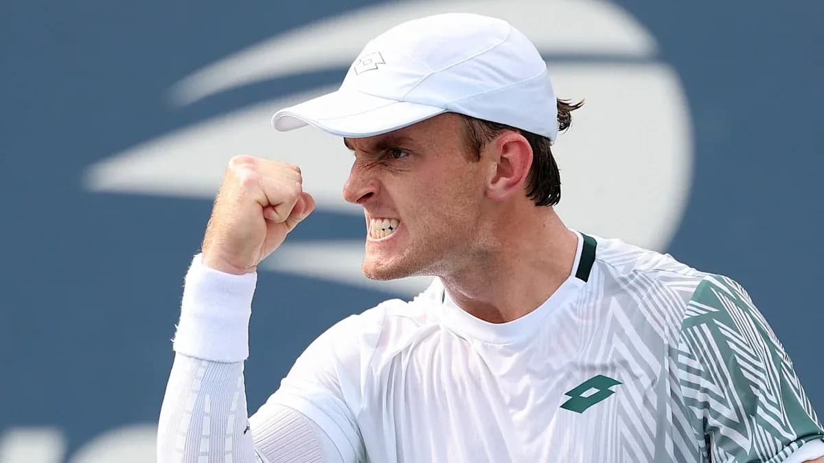 Tennis player celebrating a point with a fist pump Tennis player celebrating a point with a fist pump