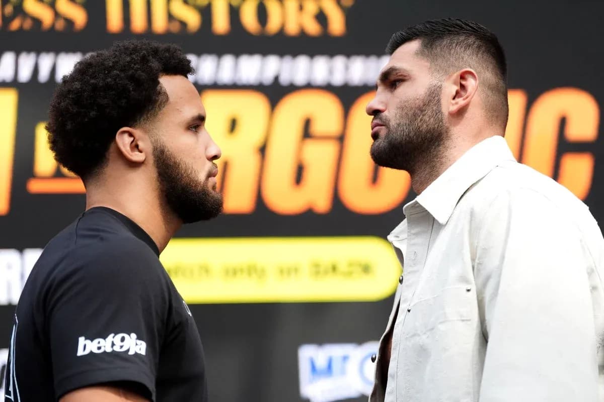 Two boxers facing off at a press conference Two boxers facing off at a press conference