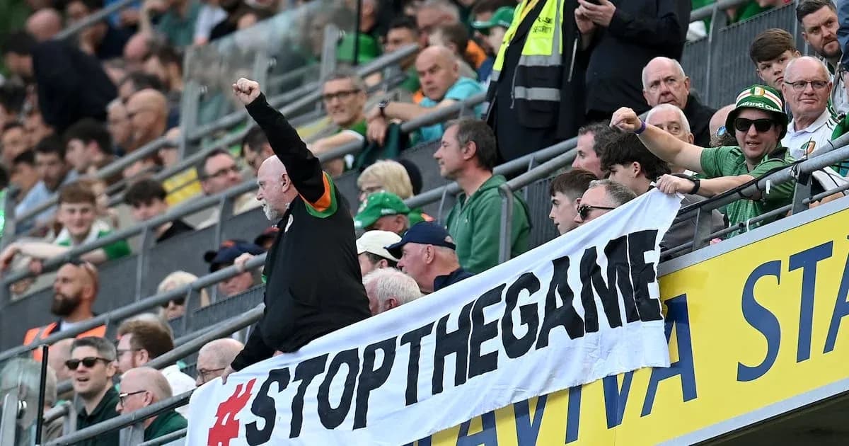 Fans holding a banner during a match Fans holding a banner during a match