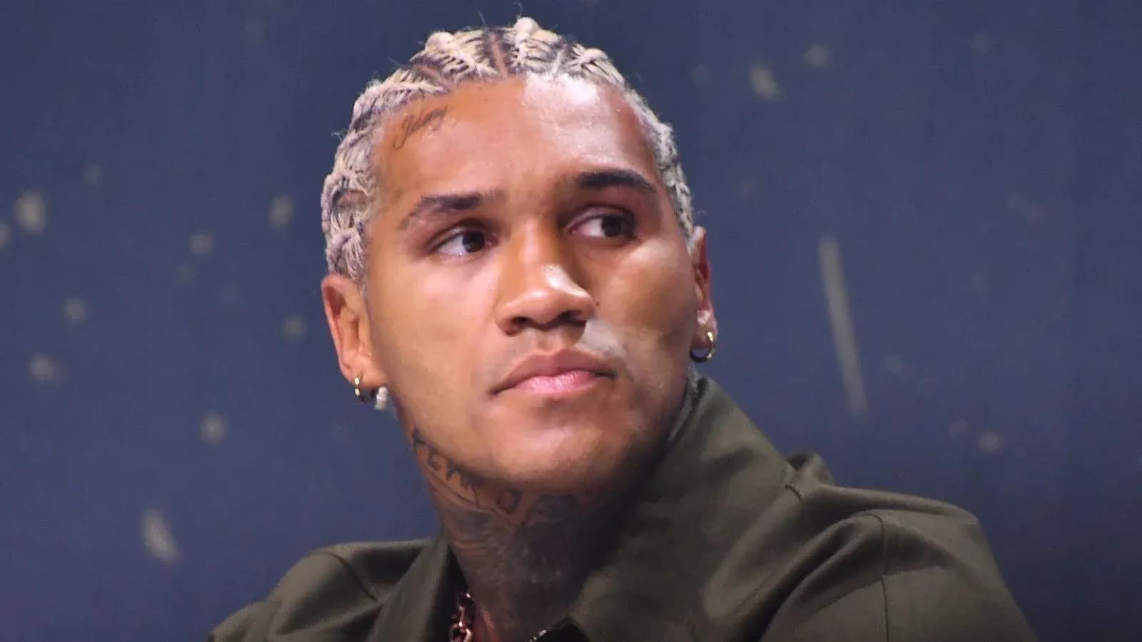 Athlete with braided hair at a press conference Athlete with braided hair at a press conference