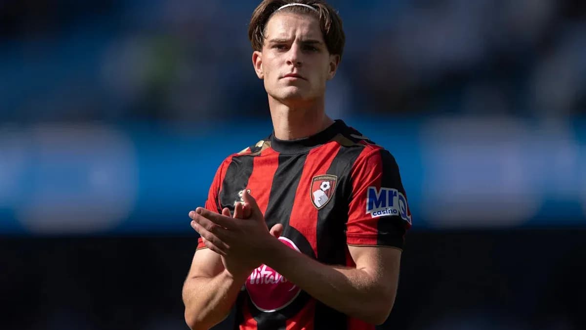 Player applauding on the pitch wearing team jersey Player applauding on the pitch wearing team jersey