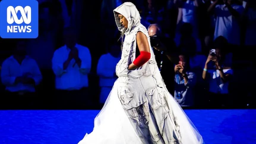 Person walking in unique outfit during event Person walking in unique outfit during event