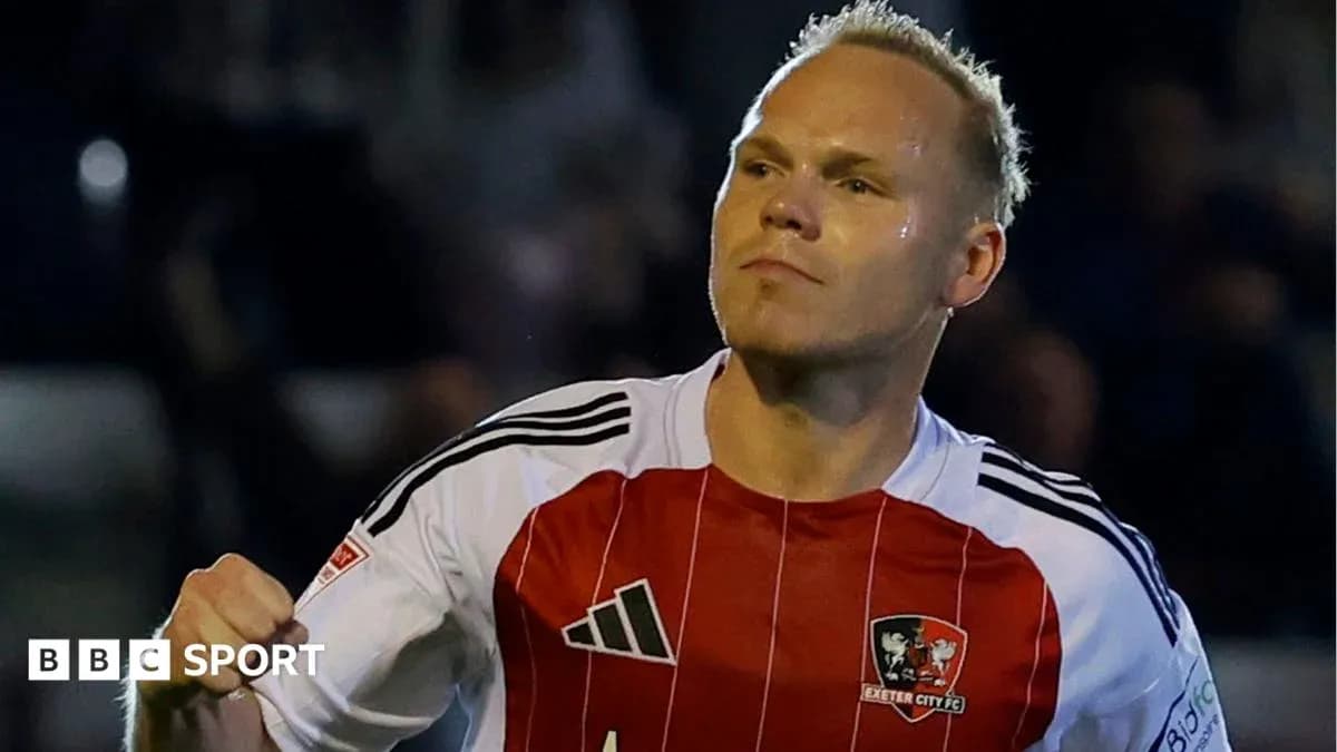 Player celebrating in Exeter City FC jersey Player celebrating in Exeter City FC jersey
