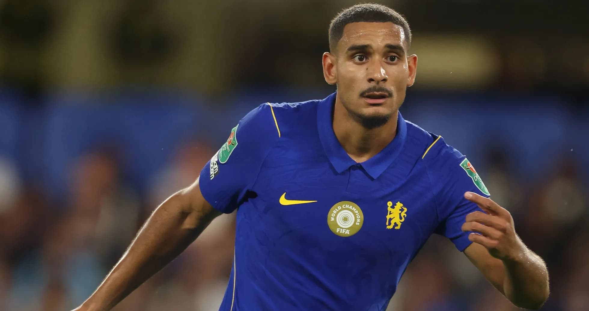 Player in blue jersey during a football match Player in blue jersey during a football match