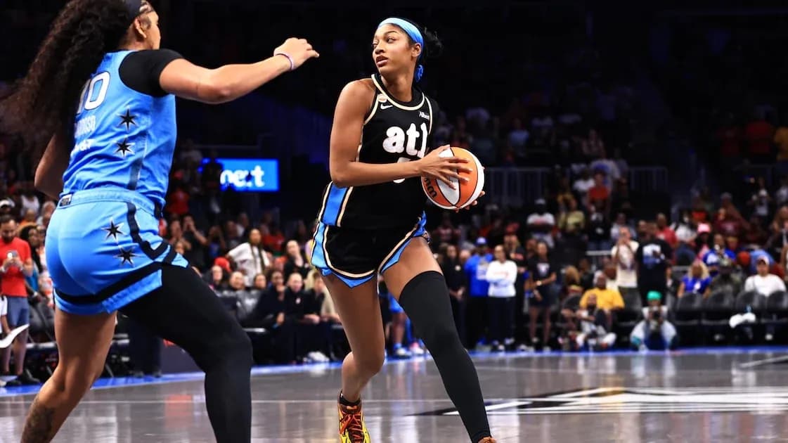 Player dribbling basketball during competitive game Player dribbling basketball during competitive game