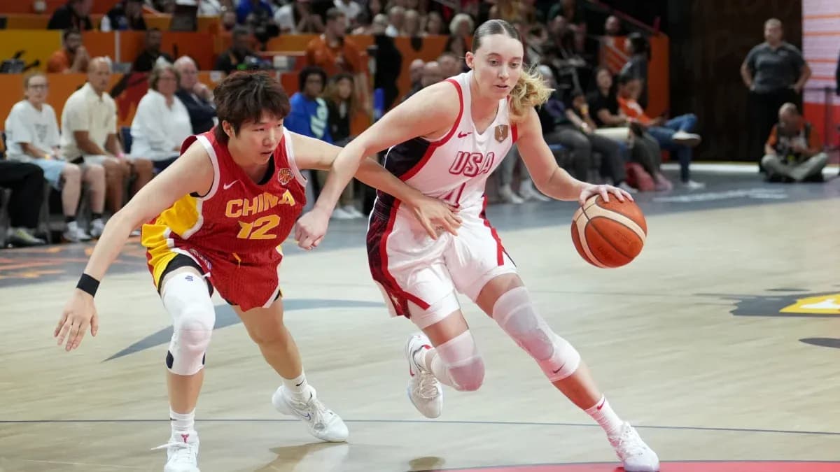 USA player dribbling past China defender during game USA player dribbling past China defender during game