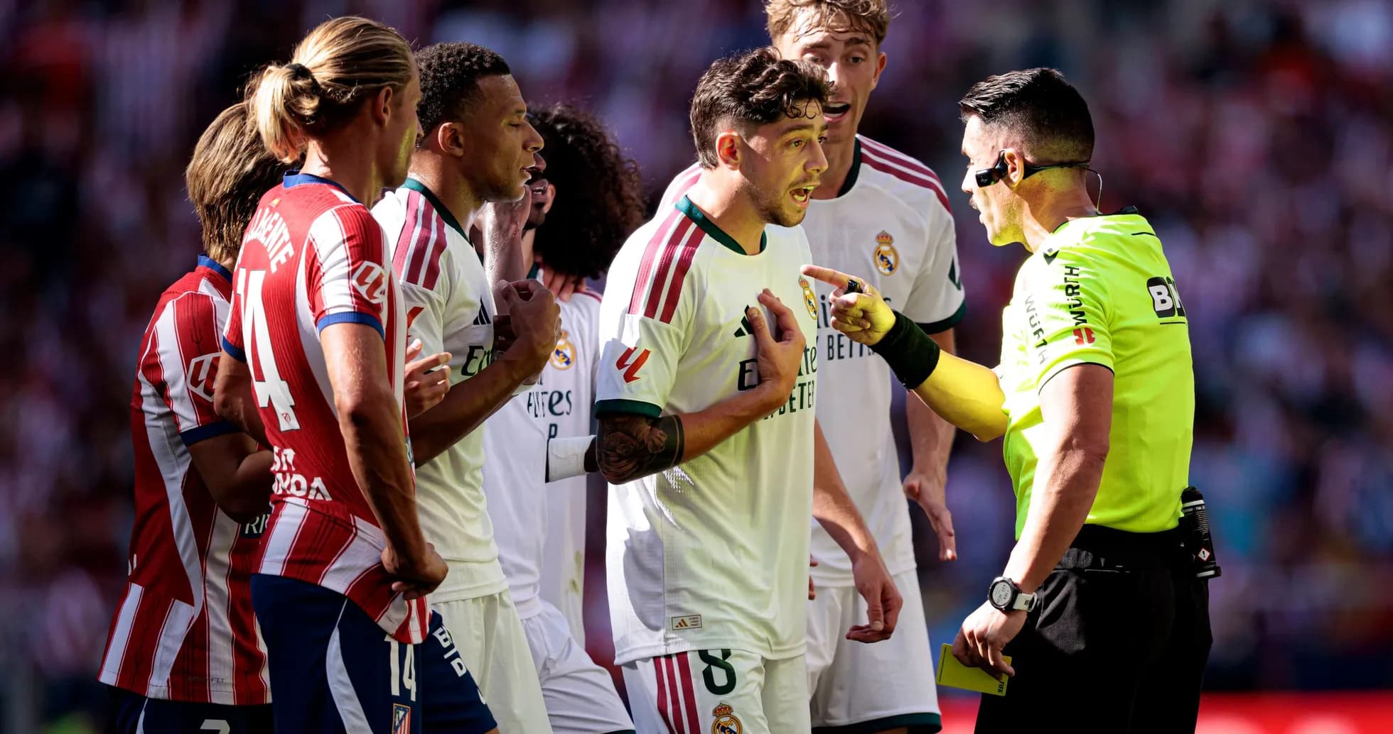 Players arguing with referee during intense match Players arguing with referee during intense match