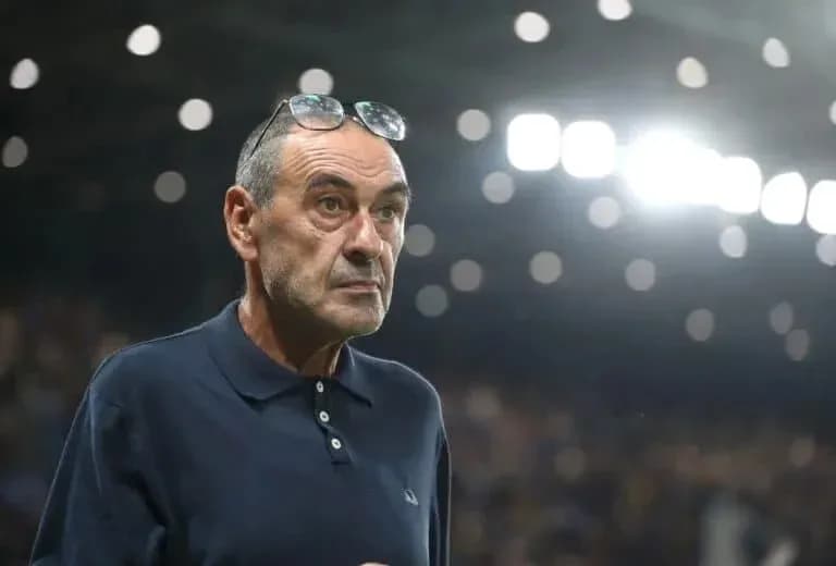 Coach observing match with glasses on his head Coach observing match with glasses on his head