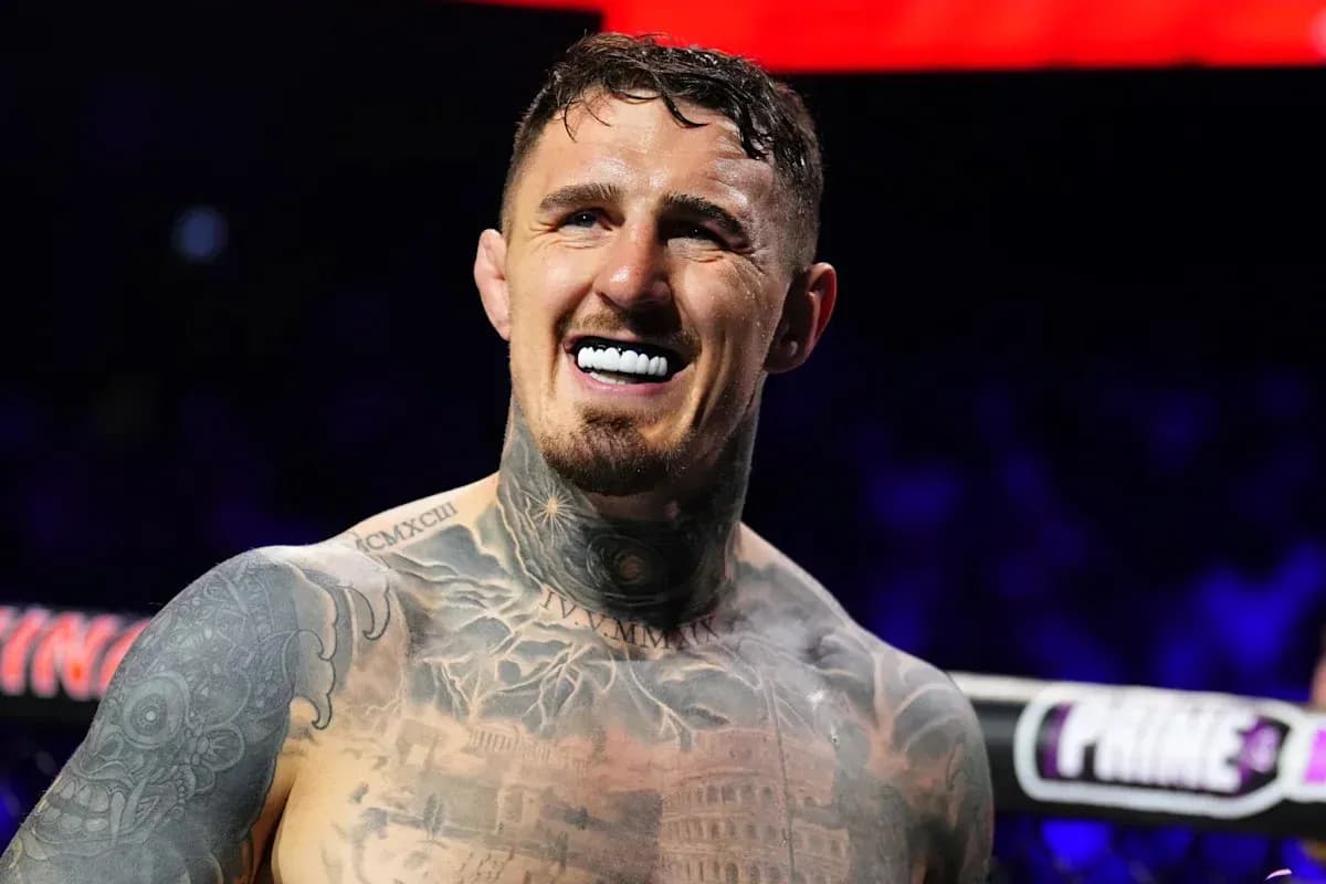 Boxer smiling with tattoos in the ring Boxer smiling with tattoos in the ring