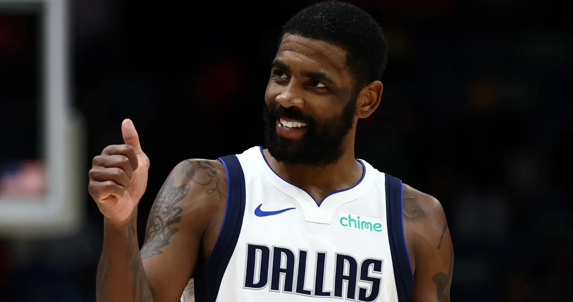 Player giving thumbs up in Dallas Mavericks jersey Player giving thumbs up in Dallas Mavericks jersey