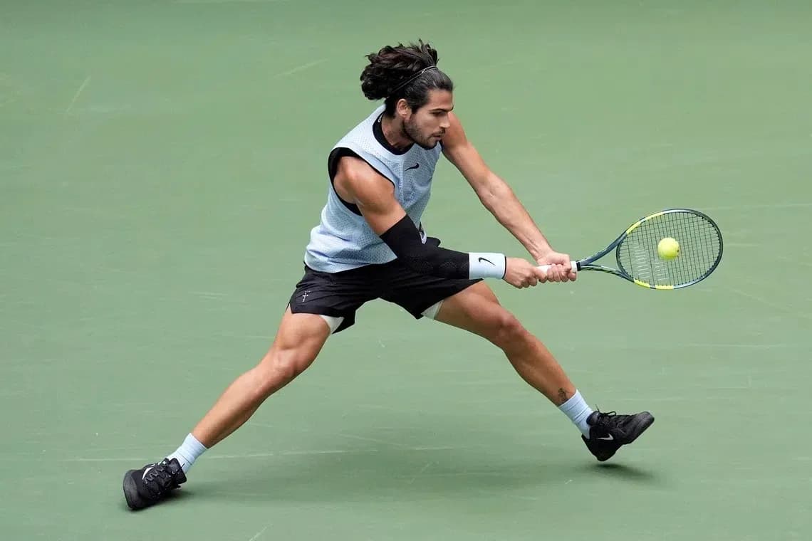 Player executing a backhand shot during match Player executing a backhand shot during match
