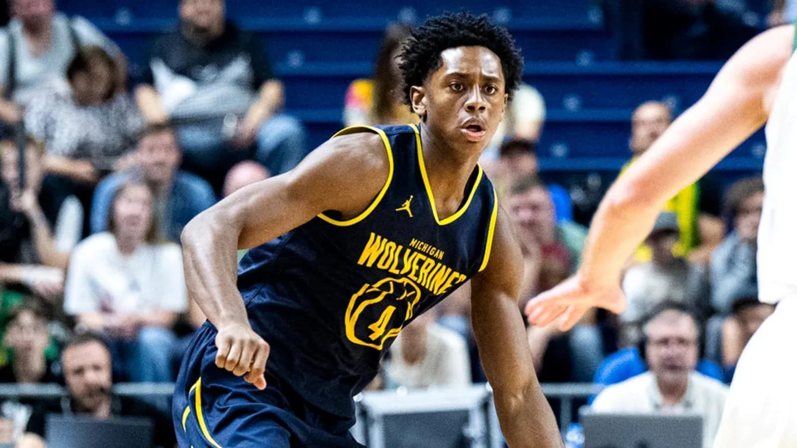 Player in Michigan Wolverines jersey during basketball game Player in Michigan Wolverines jersey during basketball game