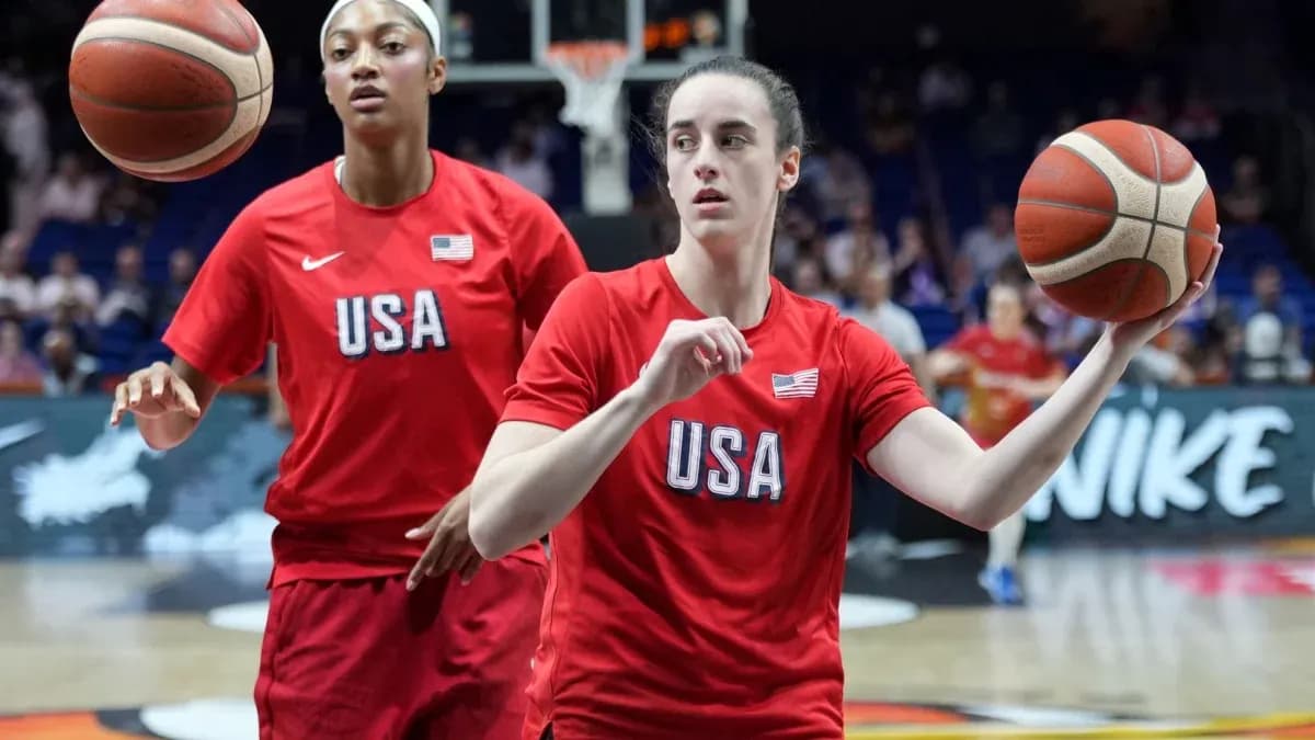 Two players warming up with basketballs in USA jerseys Two players warming up with basketballs in USA jerseys