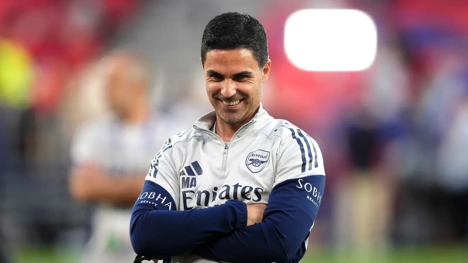 Arsenal manager smiling during match warm-up Arsenal manager smiling during match warm-up