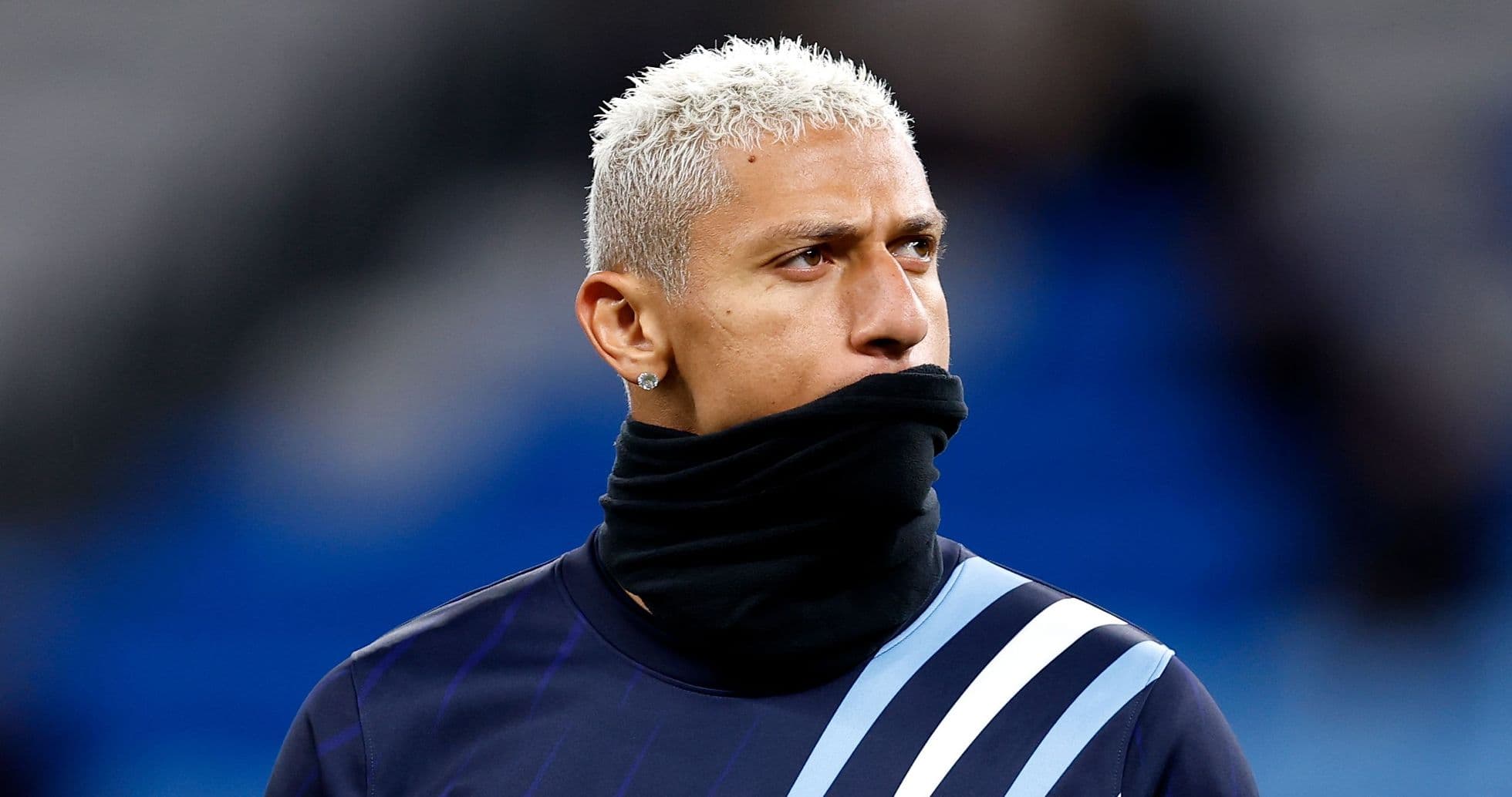 Player wearing a black scarf during warm-up Player wearing a black scarf during warm-up