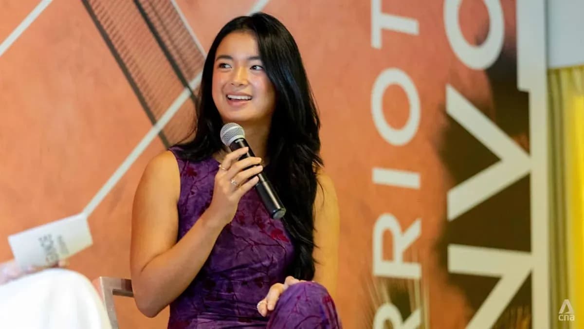 Young woman speaking into microphone at event Young woman speaking into microphone at event