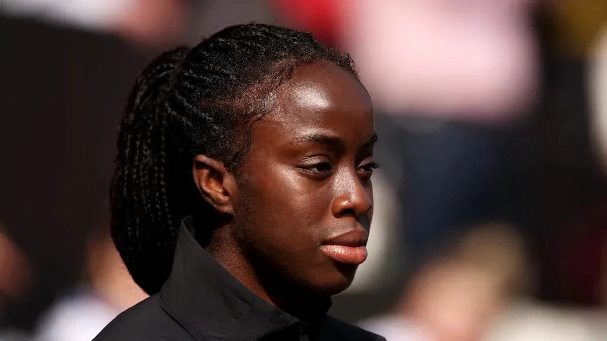Athlete in profile during a sporting event Athlete in profile during a sporting event