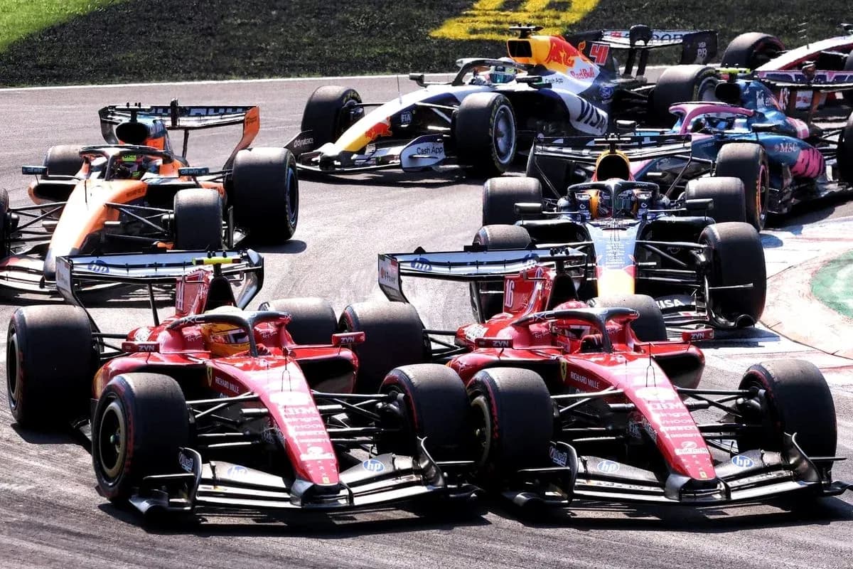 Multiple Formula 1 cars racing closely on track Multiple Formula 1 cars racing closely on track