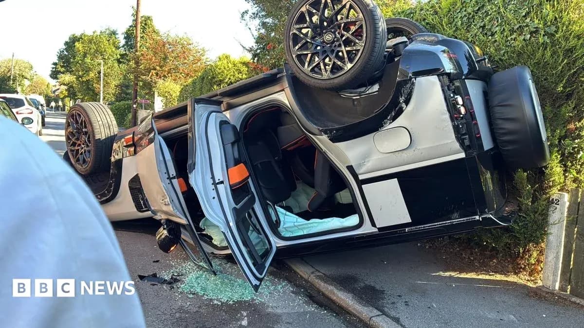 Upside-down car on side of road with debris Upside-down car on side of road with debris