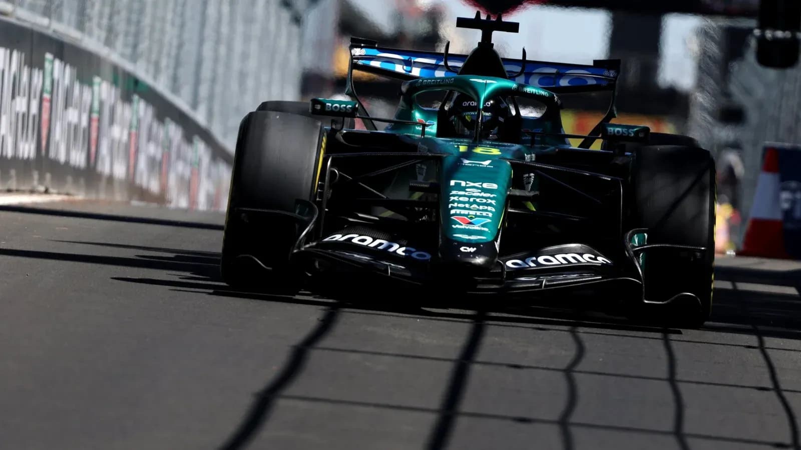Aston Martin Formula 1 car racing on track Aston Martin Formula 1 car racing on track