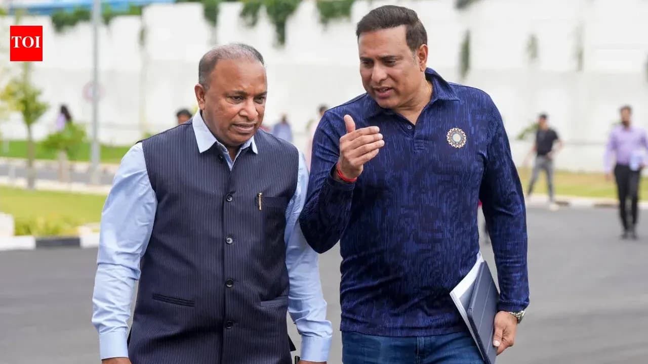 Two men walking and discussing outdoors Two men walking and discussing outdoors