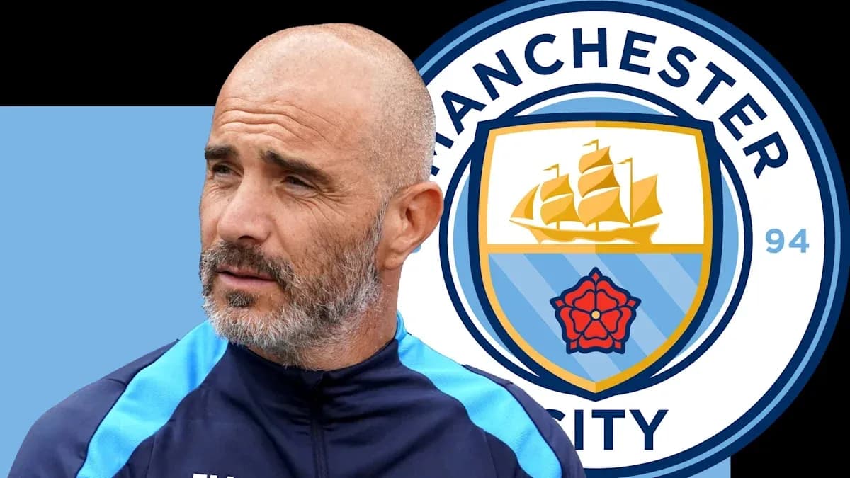 Coach with Manchester City logo in background Coach with Manchester City logo in background