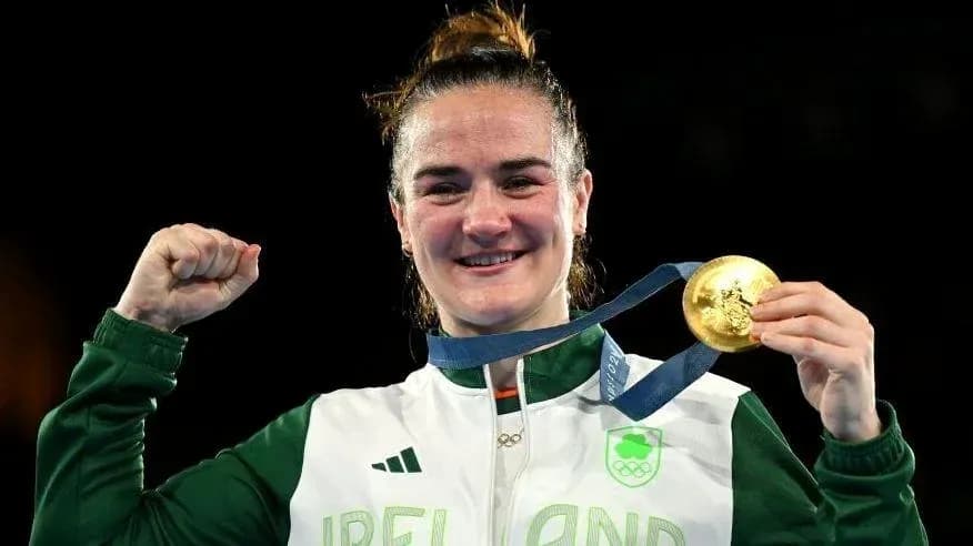 Athlete celebrating with gold medal after victory Athlete celebrating with gold medal after victory
