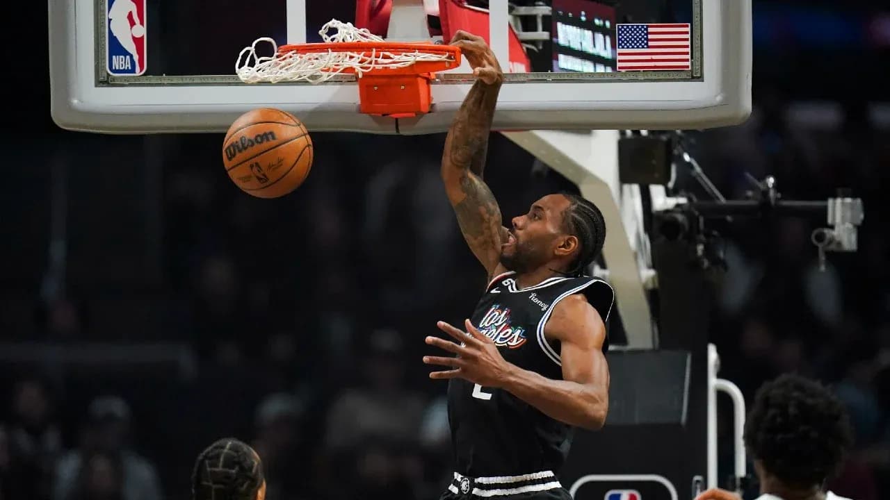 Player dunking the basketball during a game Player dunking the basketball during a game