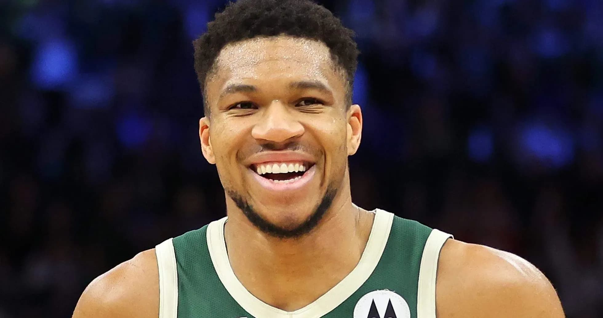 Basketball player smiling during game celebration Basketball player smiling during game celebration