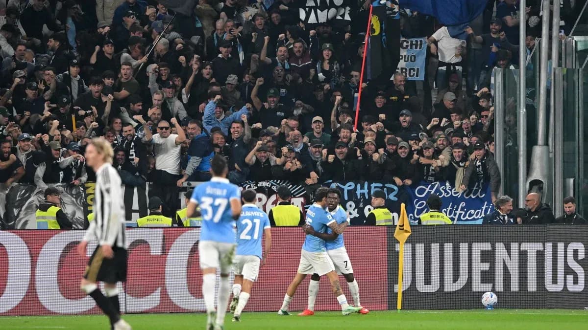 Lazio players celebrating a goal with fans cheering Lazio players celebrating a goal with fans cheering