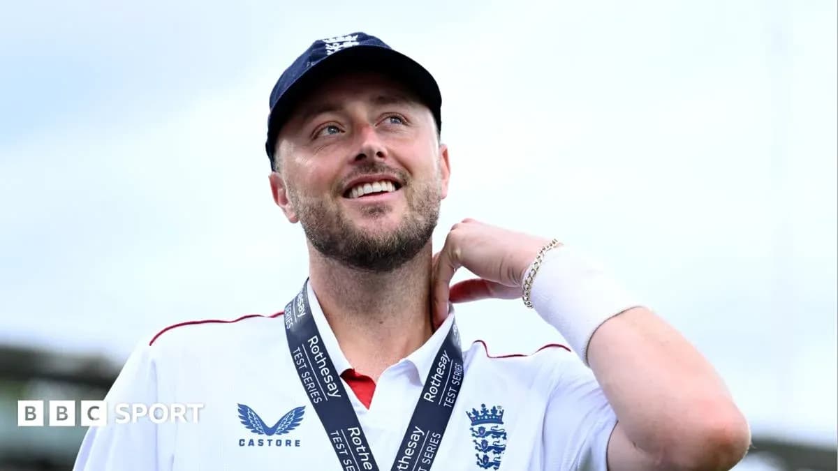 Cricketer wearing medal and smiling at event Cricketer wearing medal and smiling at event