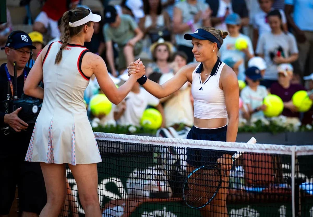 Two tennis players shaking hands at the net Two tennis players shaking hands at the net