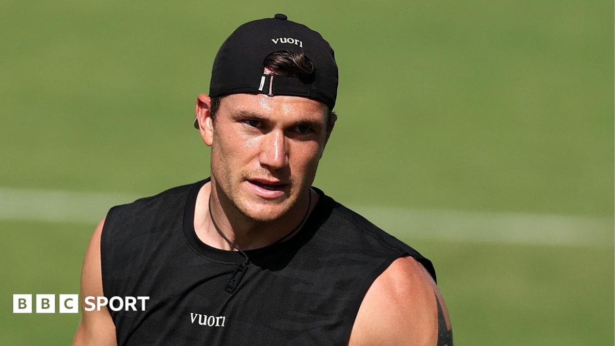 Athlete in black training gear on field Athlete in black training gear on field