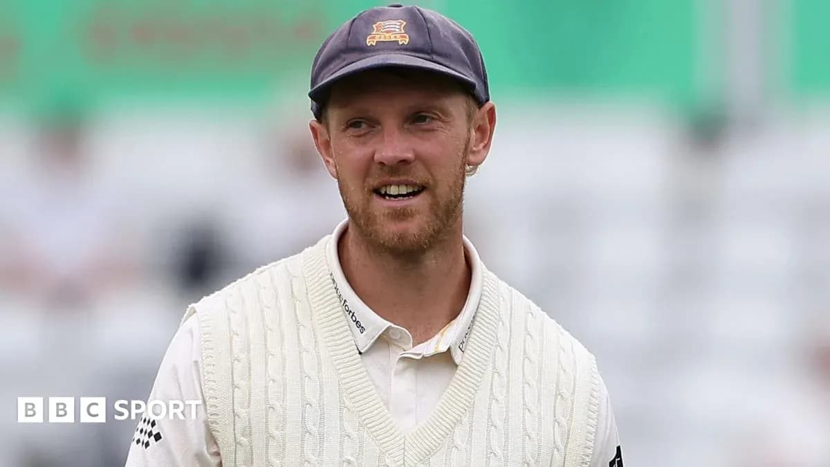 Cricketer wearing a white sweater on the field Cricketer wearing a white sweater on the field