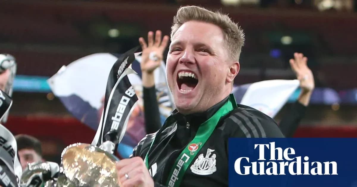 Manager celebrating with trophy after match victory Manager celebrating with trophy after match victory