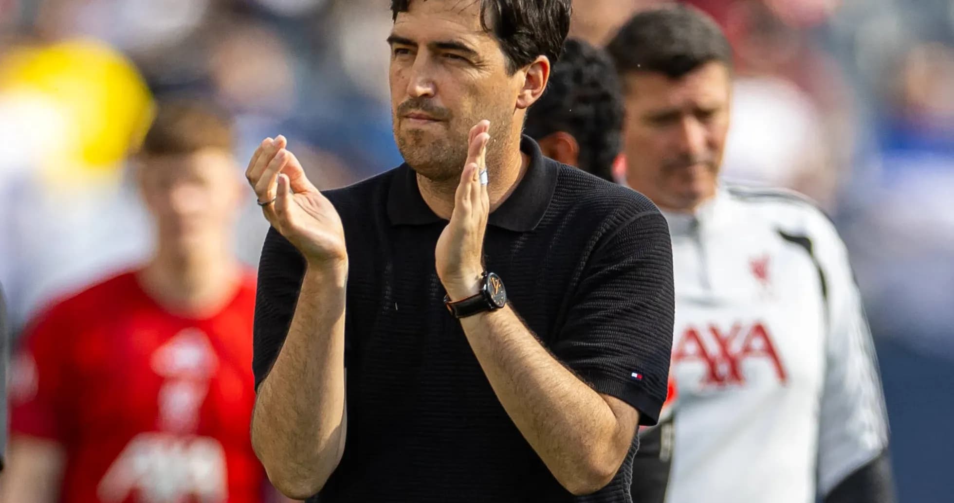 Coach applauding during a match or training session Coach applauding during a match or training session