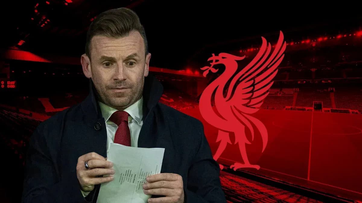 Man holding notes in front of Liverpool stadium Man holding notes in front of Liverpool stadium
