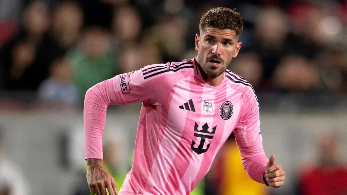 Player in pink jersey running during match Player in pink jersey running during match