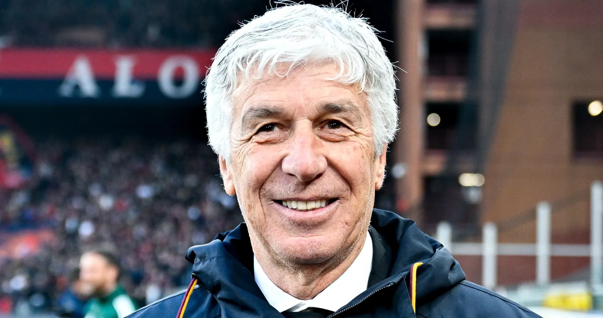 Smiling coach on the sidelines at stadium Smiling coach on the sidelines at stadium
