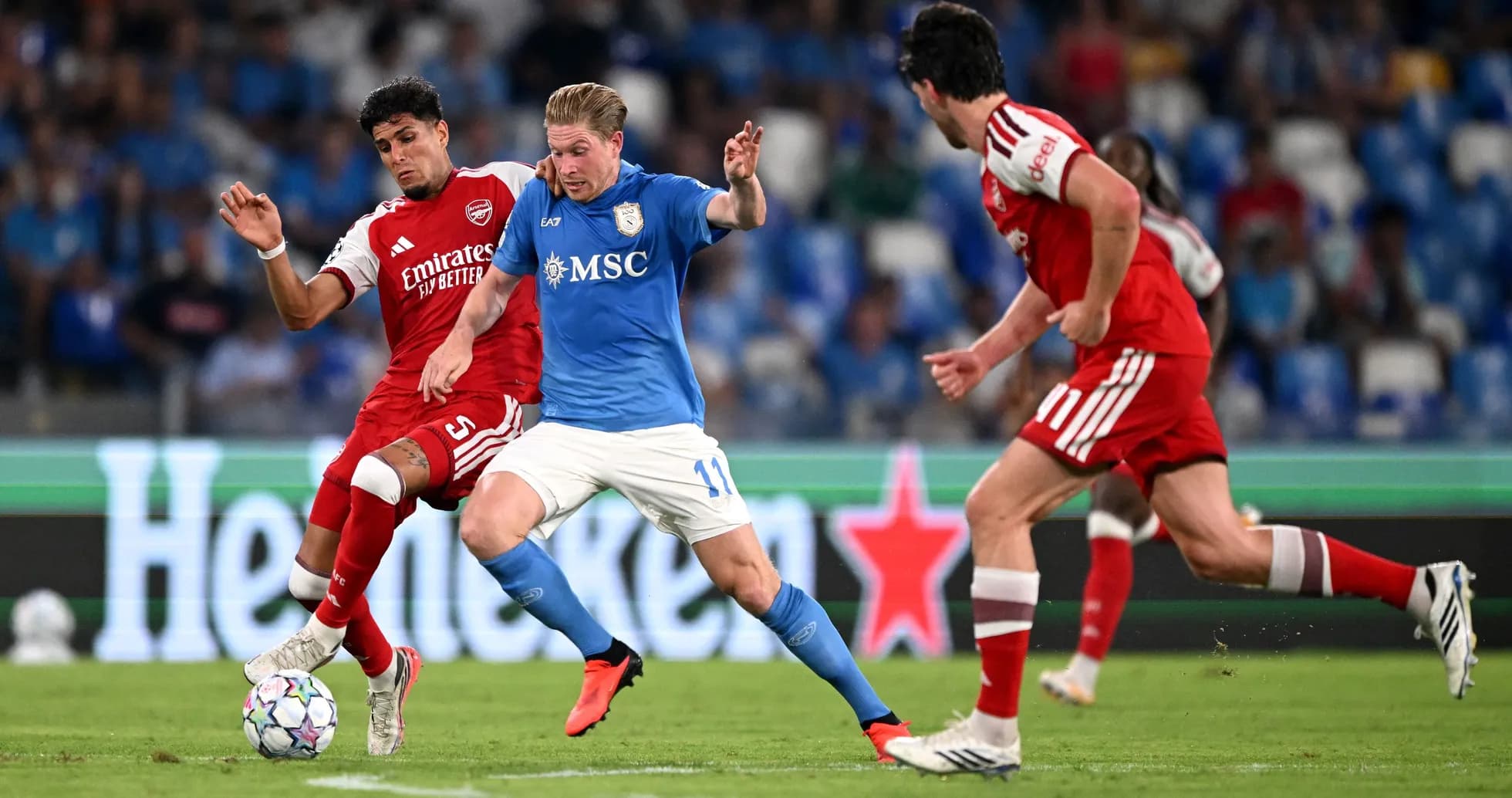 Players competing for the ball during a match Players competing for the ball during a match