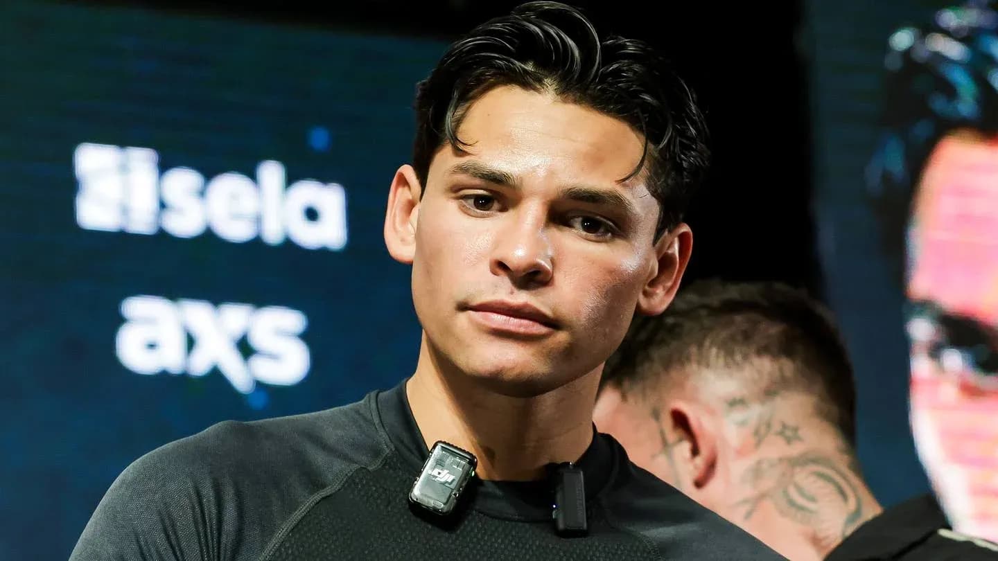 Boxer preparing for event with microphone attached Boxer preparing for event with microphone attached
