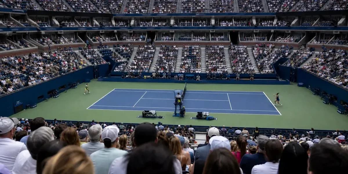 Tennis match in stadium with large audience Tennis match in stadium with large audience