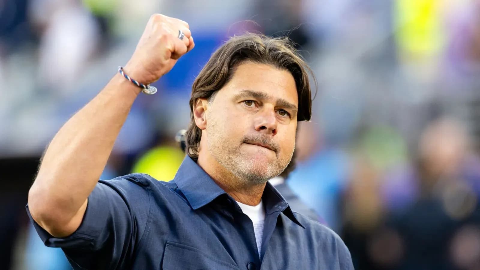 Coach celebrating with fist raised on field Coach celebrating with fist raised on field