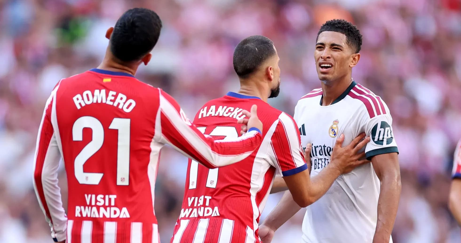 Atletico Madrid players confront Real Madrid player Atletico Madrid players confront Real Madrid player