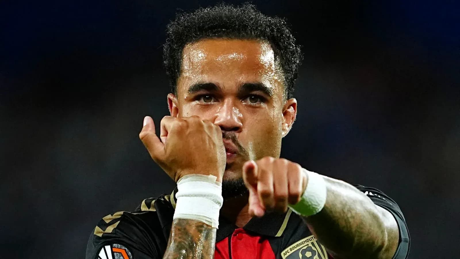 Player celebrating with clenched fists during match Player celebrating with clenched fists during match