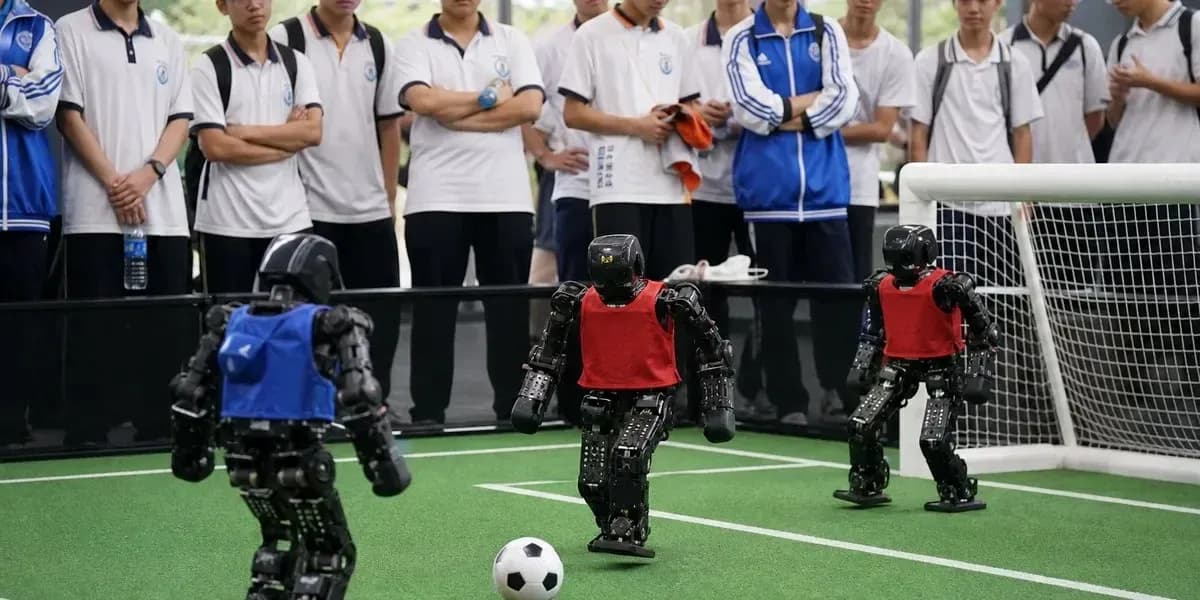 Robots playing soccer with spectators watching Robots playing soccer with spectators watching